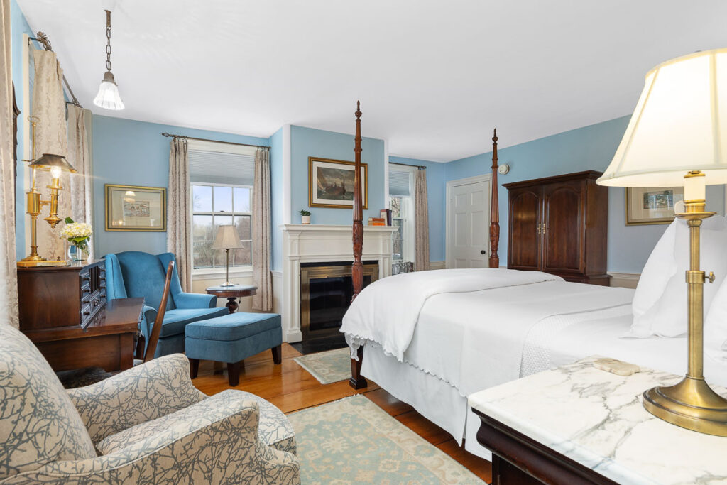 hand-carved, four-poster, and amazingly comfortable Queen-sized bed, the inviting fireplace, cozy chairs for reading or relaxing, the recently refinished 200-year-old wood floors.