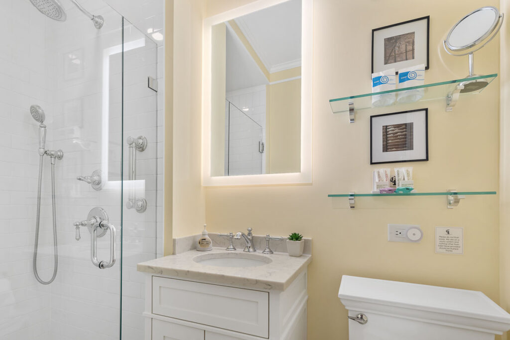 Private, newly renovated bathroom in each guest room with premium finishes; and shower.