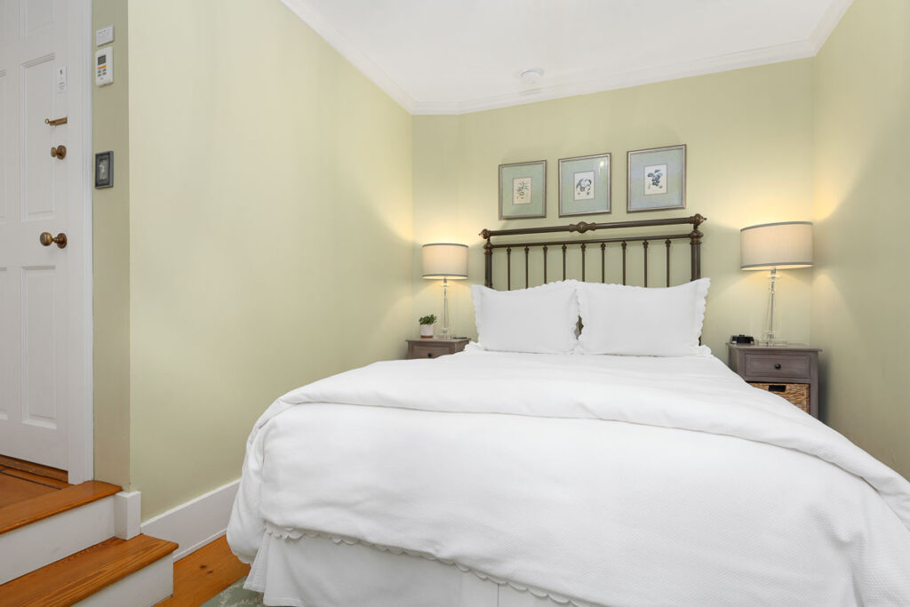 Queen-sized bed and private bath tucked away on the second level in the Main House with views of the west gardens.