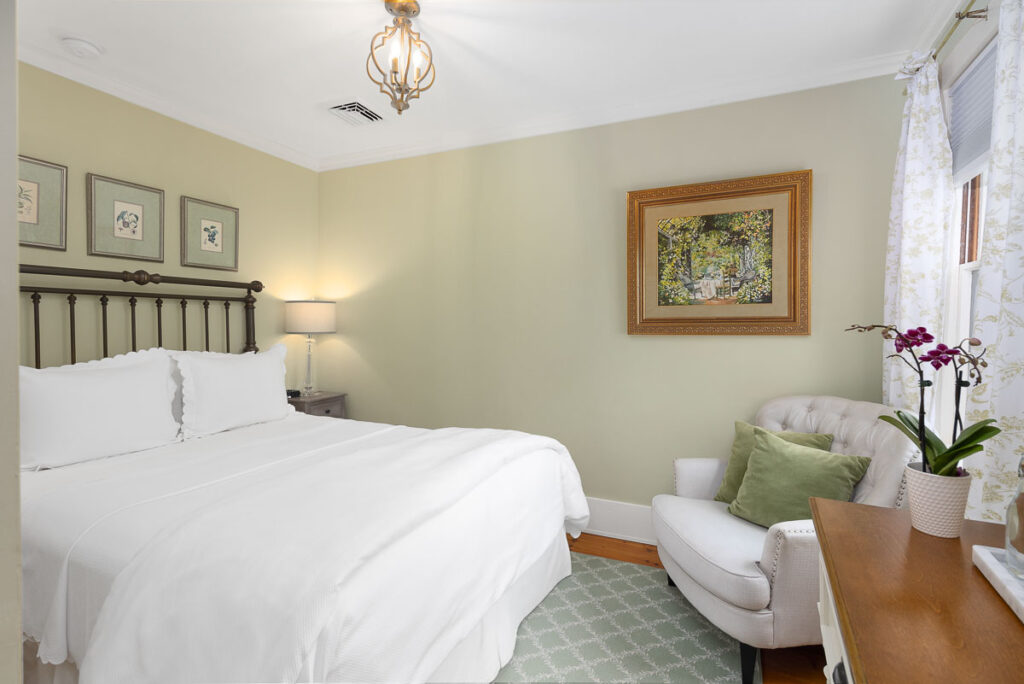 Queen-sized bed and private bath tucked away on the second level in the Main House with views of the west gardens.