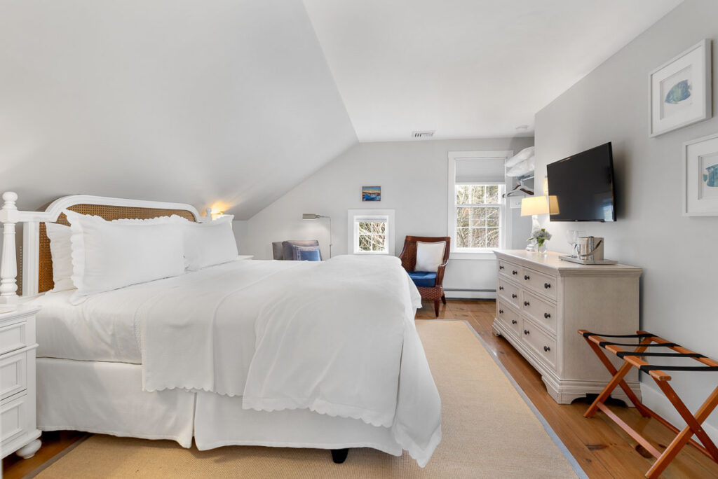 The Seabreeze Room is located in the Carriage House on the second level with a King-sized bed. You can enjoy the luxury and elegance of the inn while also enjoying a semi-private deck that truly gives you the Cape Cod beach cottage feel.