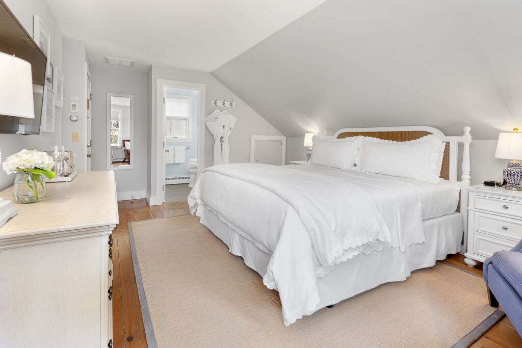 The Seabreeze Room is located in the Carriage House on the second level with a King-sized bed. You can enjoy the luxury and elegance of the inn while also enjoying a semi-private deck that truly gives you the Cape Cod beach cottage feel.