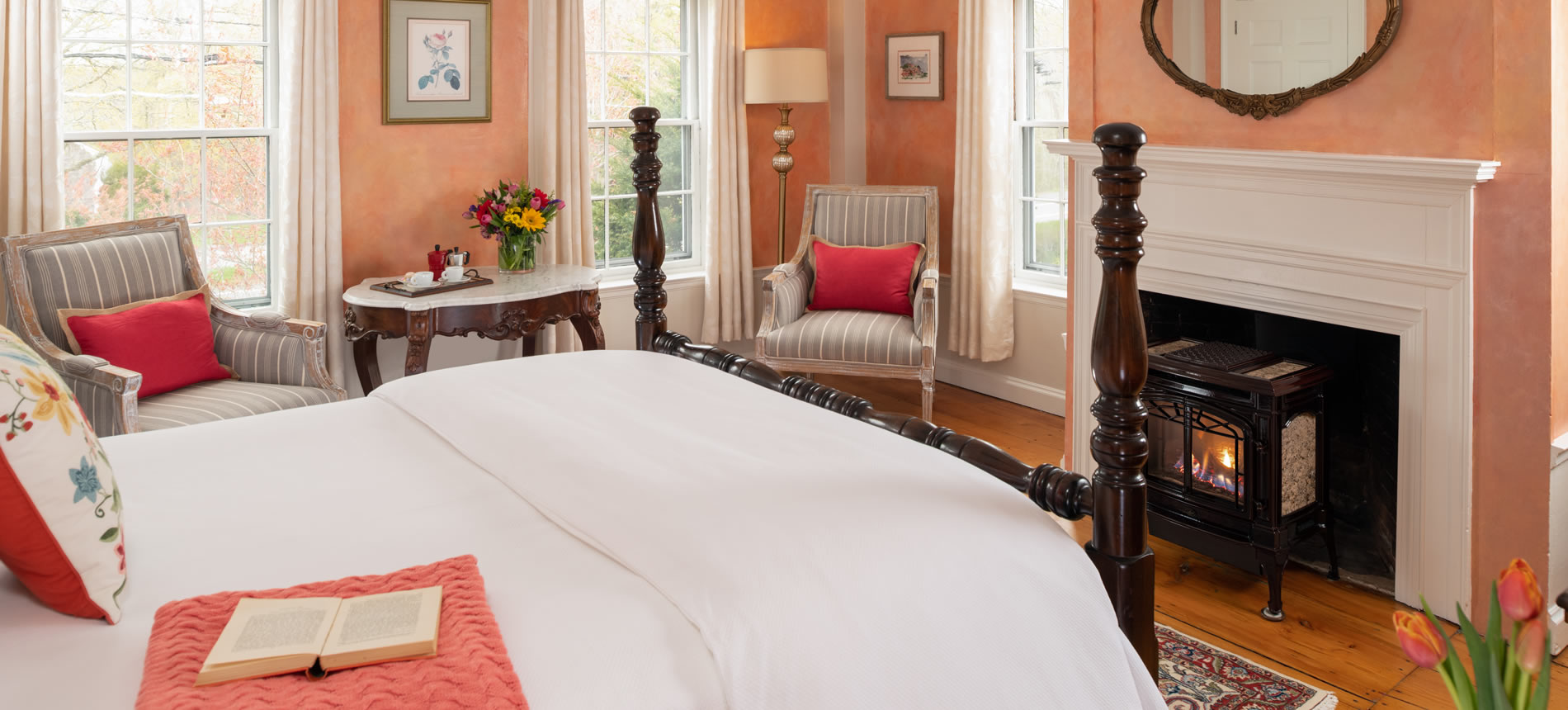 The Beach Rose Room is a second floor room at the Candleberry Inn with a Queen-sized bed and gas fireplace, perfect for a romantic getaway on Cape Cod.