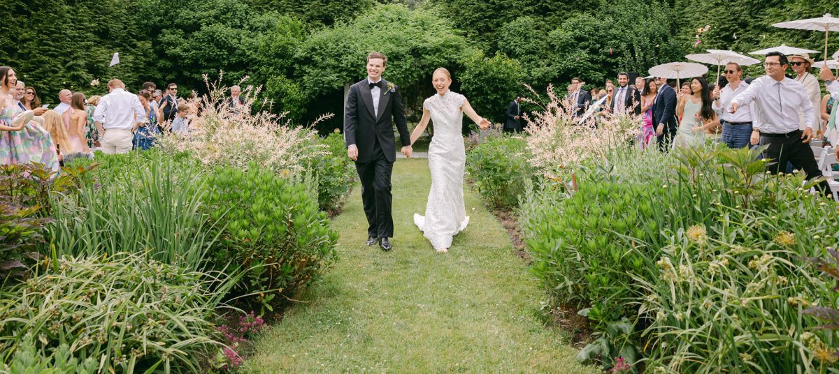 wedding couple at lambert's cove inn gardens