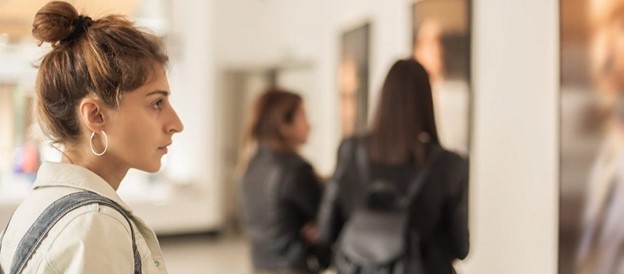 Museums & Galleries with woman looking at something interesting