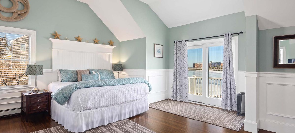 guest room with water view at the beacon boutique inn in hull ma