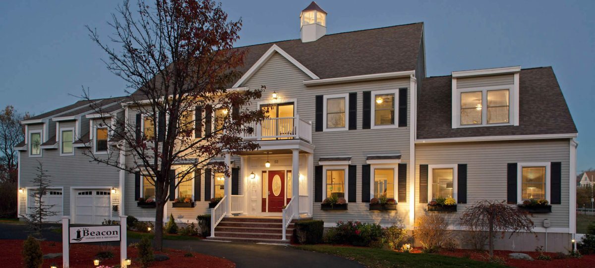 the beacon waterfront boutique hotel exterior at evening light